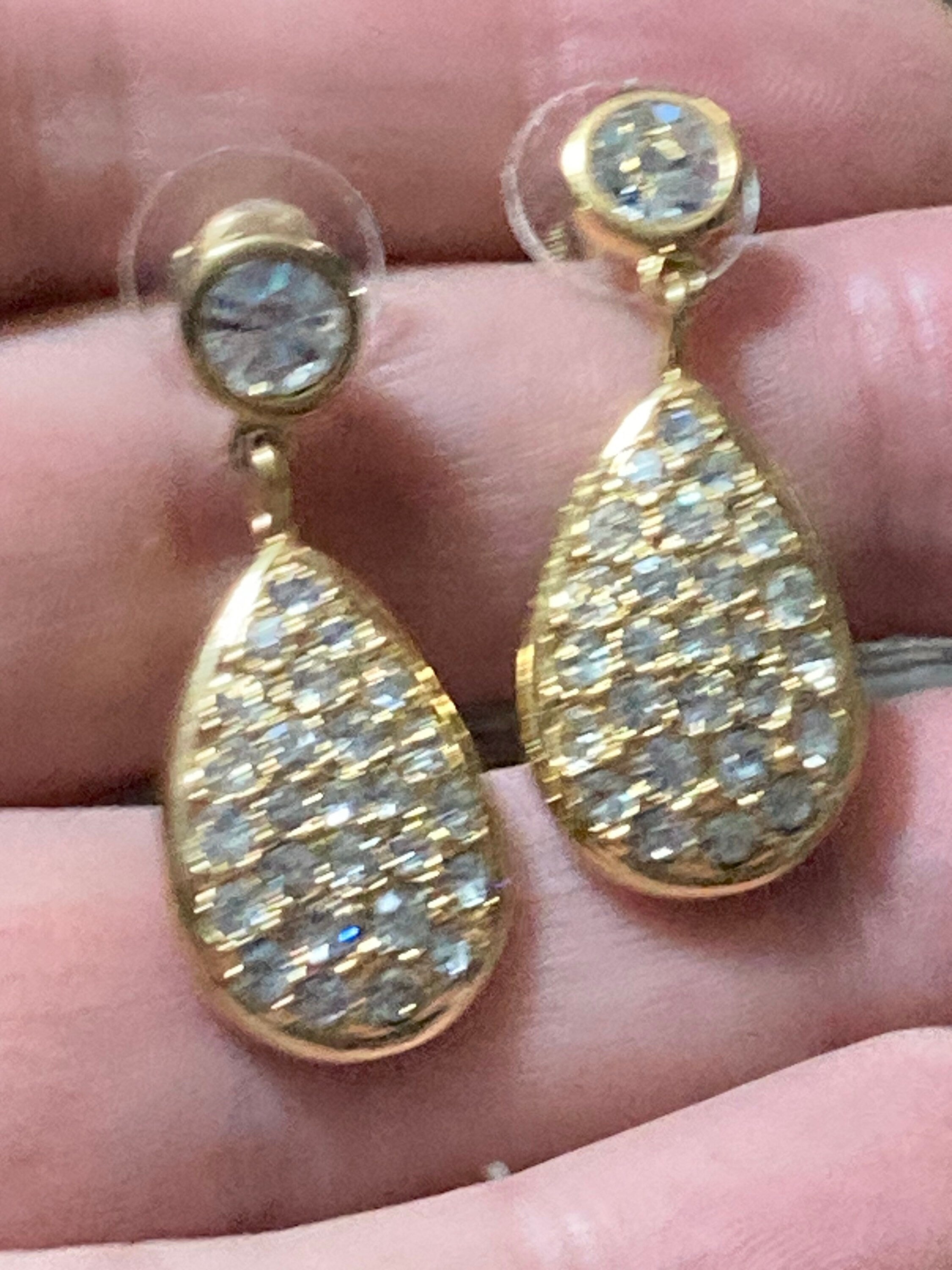 Swarovski Gillian Droplet Snake Chain Rhodium Plated & Crystal Earrings  £69.00 | Earings piercings, Jewelry earrings, Clear crystal earrings